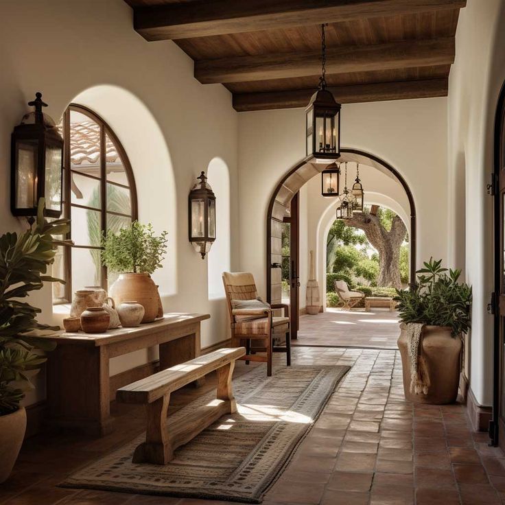 an arched hallway with benches and potted plants on either side, surrounded by arches