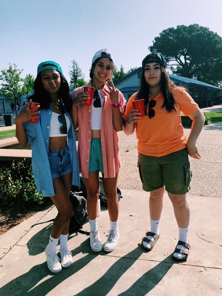 three young women standing next to each other