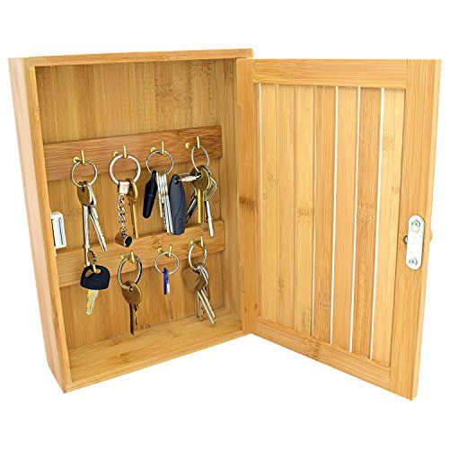 an open wooden box with keys in it