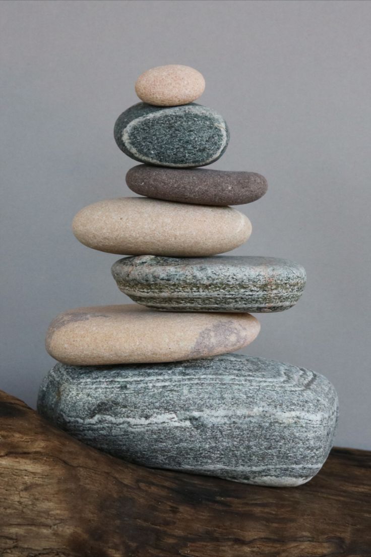 a stack of rocks sitting on top of a wooden table