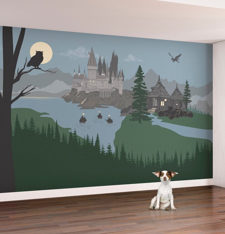 a dog sitting on the floor in front of a wall with a castle and lake mural