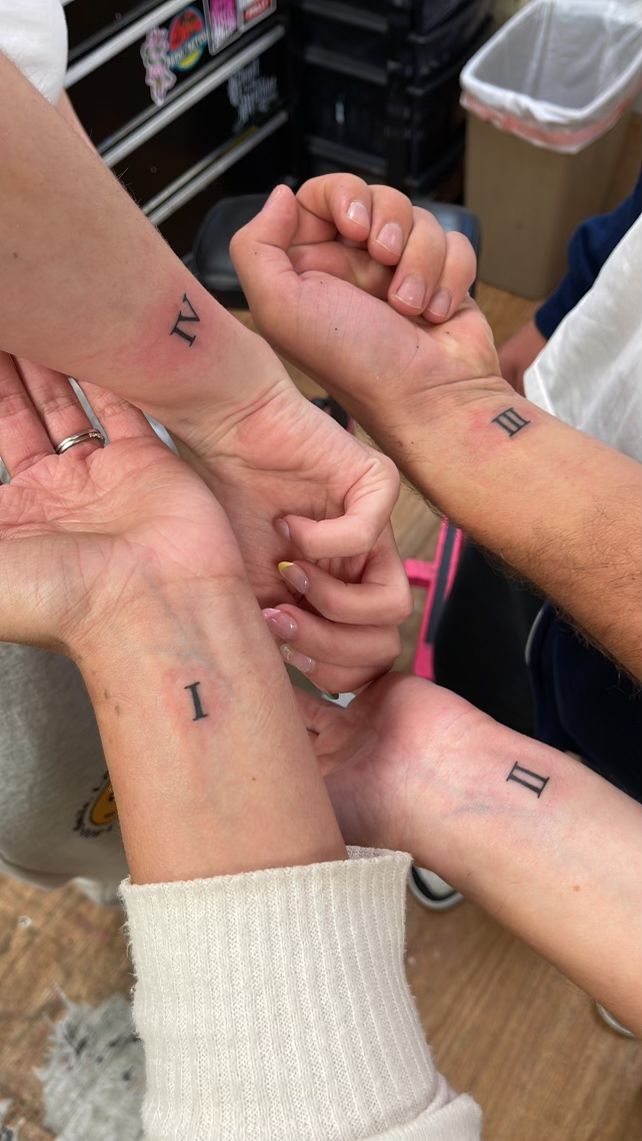 Birth order Roman numerals matching sibling tattoo Sibling Tattoos Roman Numerals, Tattoo Ideas Siblings Four, 4 Way Matching Tattoos, Sibling Roman Numeral Tattoo, 4 Matching Tattoos Friends, Matching Sister Tattoos For 4 Sisters, Matching Tattoos For Friends Of 4, Matching Tattoos Siblings Of 4, Best Sibling Tattoos