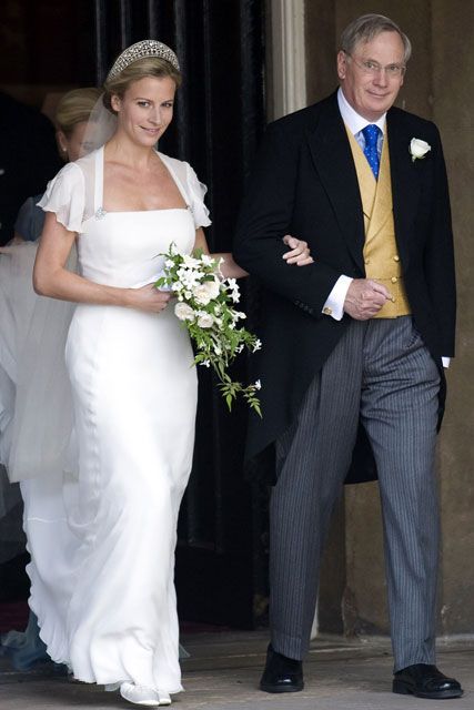 the bride and groom are walking down the aisle