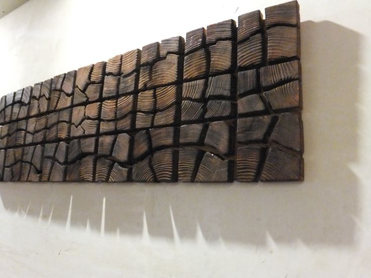 a piece of wood that is sitting on the wall