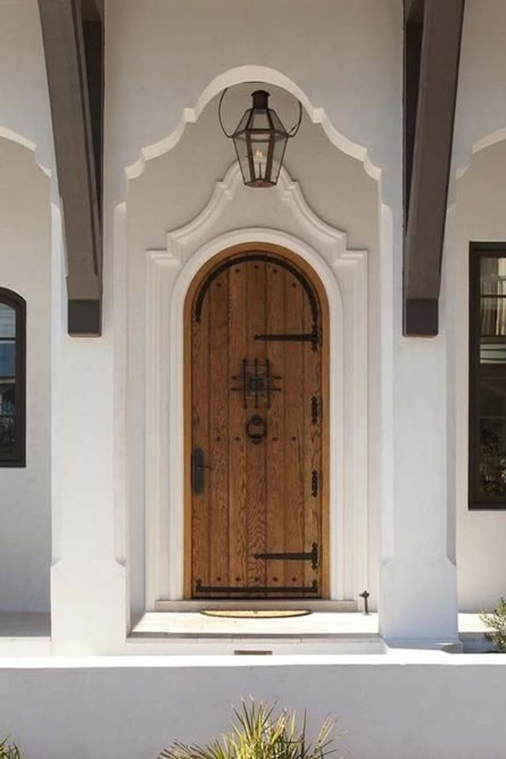 a white house with a large wooden door