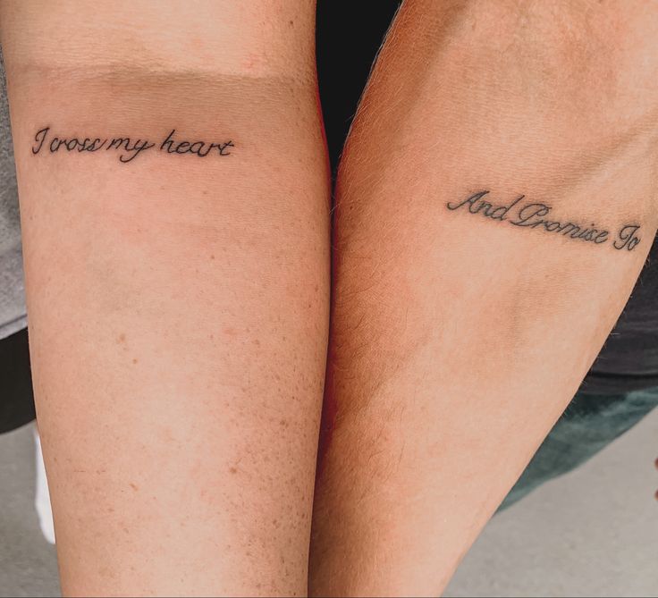 two people with tattoos on their legs that say, i love my heart and someone else