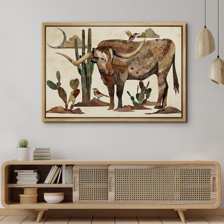 an animal painting hanging on the wall above a wooden shelf in a room with white walls