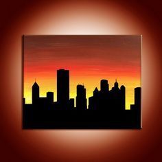 an image of a city skyline at sunset