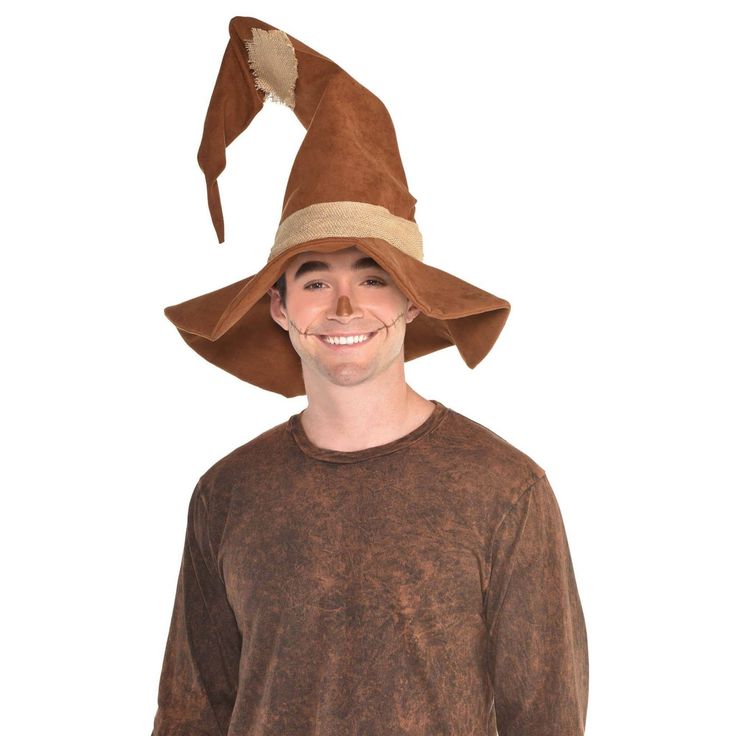 Buy the Scarecrow Costume Hat at Michaels. com. Top your look off with this large pointy hat, perfect for scarecrow costumes. Top your look off with this Scarecrow Hat. This large pointy hat features a hat band and matching patch. It is perfect for scarecrow costumes. Details: Brown One size fits most teens and adults Includes hat Makeup and shirt not included Spot clean | Scarecrow Costume Hat By Amscan | Adult | Michaels® Scarecrow Costumes, Scarecrow Hat, Scarecrow Costume, The Scarecrow, Costume Hats, Hat Band, Scarecrow, Adult Costumes, Costume Accessories