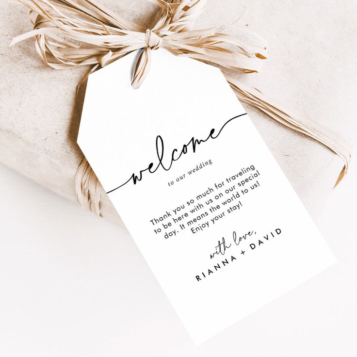 a welcome card tied to a gift bag