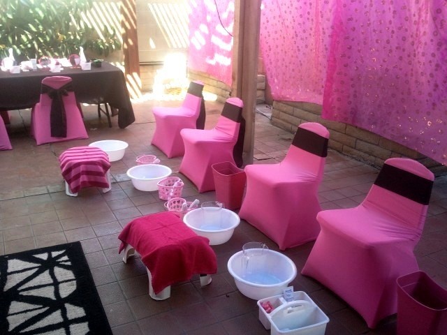 pink and black chairs are set up for a party