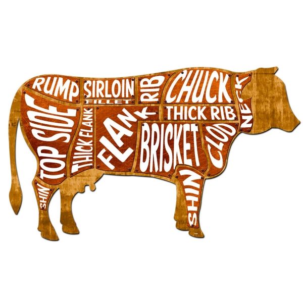 a wooden cutout of a cow with words written all over it