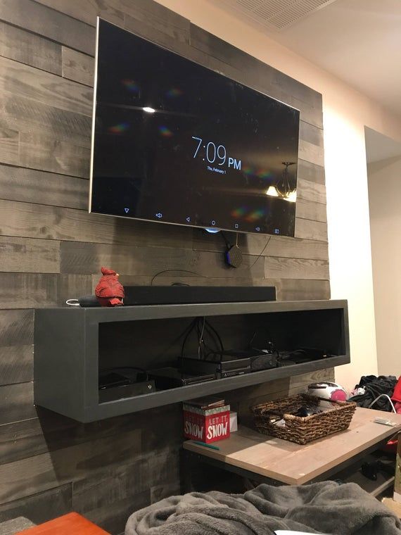 a flat screen tv mounted to the side of a wall