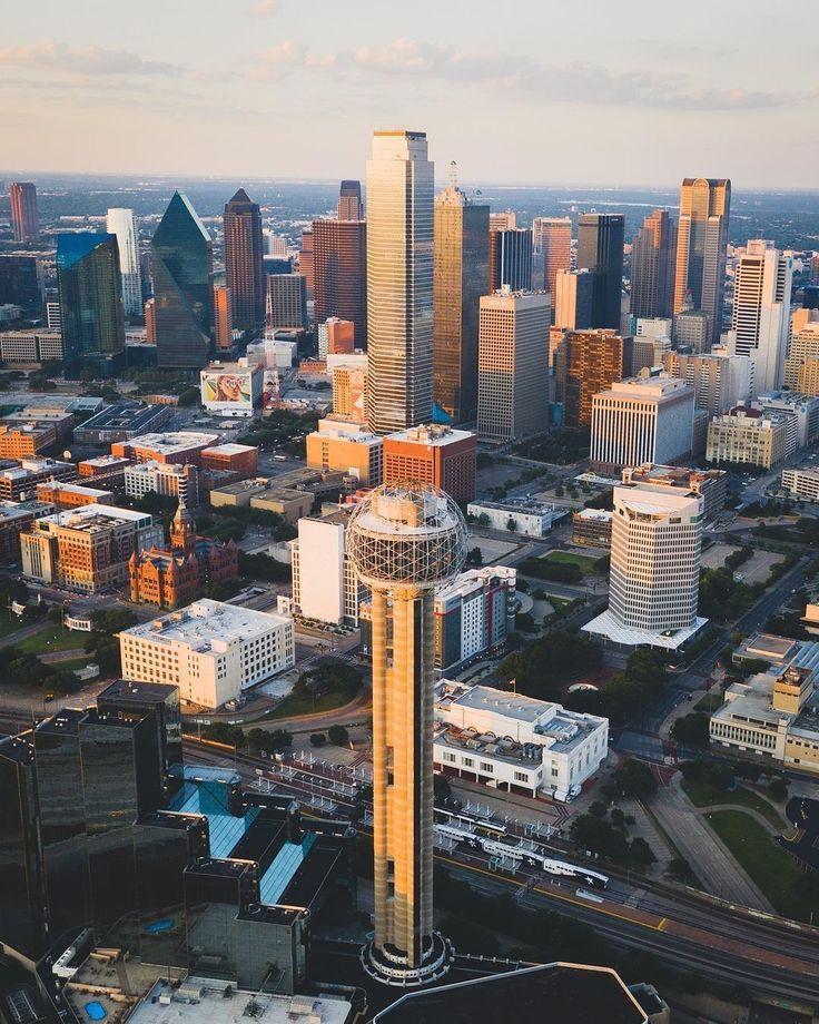 an aerial view of a city with tall buildings