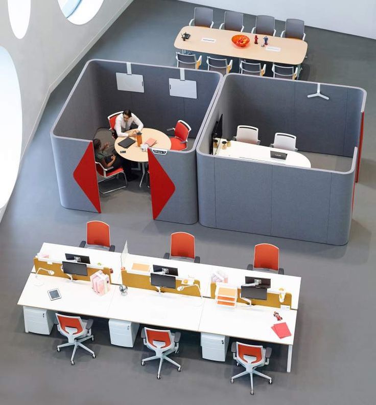 an office cubicle with people working at desks