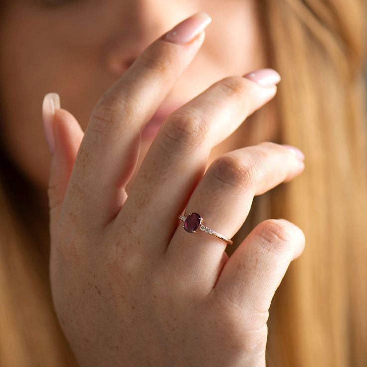 Natural ruby ring made in 14k or 18k rose gold and set with diamonds on the side. This ring is also suitable for anniversaries, gifts, or any other special occasion. This listing is for ROSE GOLD. you can order other colors from the following links: ● Yellow gold - www.etsy.com/il-en/listing/1066684973 ● White gold - www.etsy.com/il-en/listing/1054246238/ ♦ CENTER GEMSTONE SPECIFICATIONS ♦ Type: Ruby Shape: Oval Cut Carat Weight: 0.74ct Color: Purplish Red Clarity: VS ♦ SIDE DIAMONDS SPECIFICATI 14k Rose Gold Ruby Promise Ring, Rose Gold Ruby Ring With Halo Setting For Promise, Rose Gold Ethical Diamond Promise Ring, Rose Gold Ruby Promise Ring With Rose Cut Diamonds, Rose Gold Diamond Ring With Rose Cut For Proposal, Rose Gold Diamond Birthstone Ring For Proposal, Luxury Rose Gold Diamond Birthstone Ring, 14k Rose Gold Ruby Ring For Promise, Diamond Accented Ruby Ring In Rose Gold