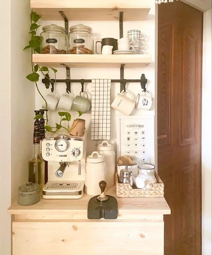 the shelves are filled with pots, cups and other kitchen items on top of them