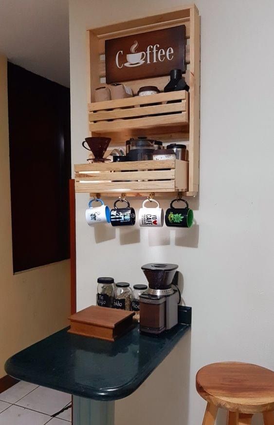 a coffee bar with two wooden crates on the wall