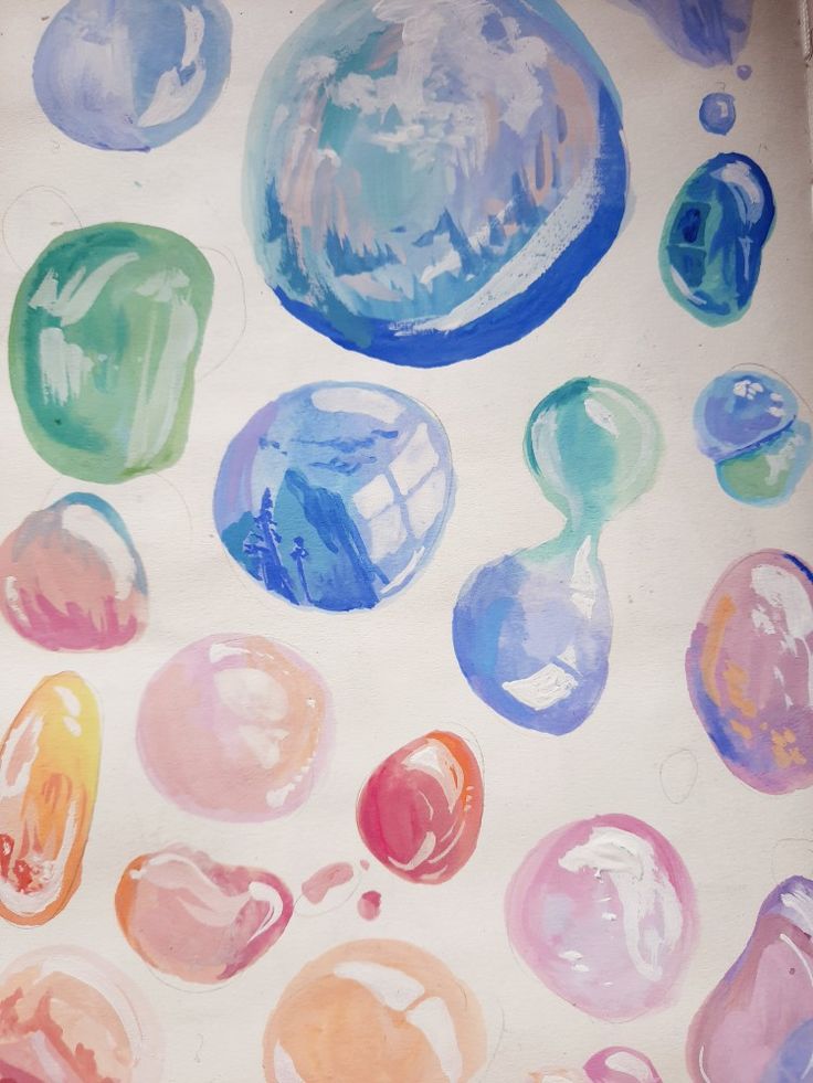 an art project with watercolors and pastel paint on paper, including bubbles