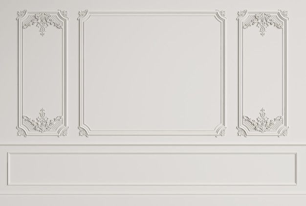 an empty room with white walls and decorative moldings