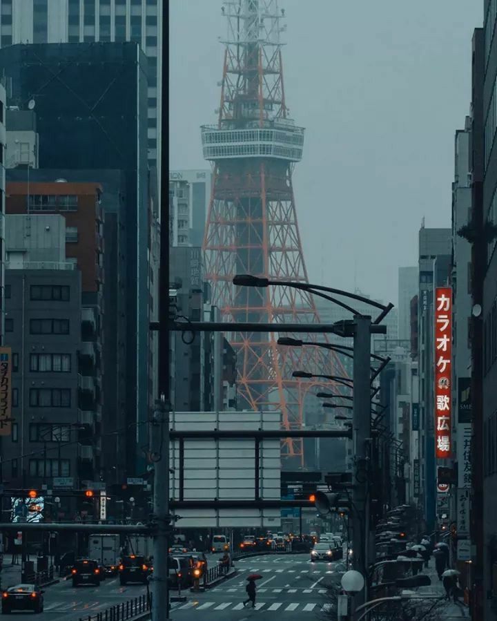 a very tall tower towering over a city