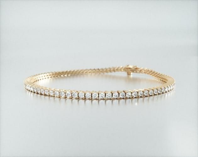 14K Yellow Gold Two Prong Diamond Tennis Bracelet (2 CTW - H-I / SI1-SI2). This classic tennis bracelet features a single row of scintillating brilliant cut diamonds set in finely crafted two prong baskets. aka Tennis Bracelets 2 Ct Diamond Bracelet, Fake Diamond Tennis Bracelet, Tennis Bracelet Cartier Watch, Bracelets Tennis, Gold Tennis Bracelet, Diamond Tennis Bracelet, Gold Signet Ring, Natural Gemstone Jewelry, Jewelry Fashion Trends