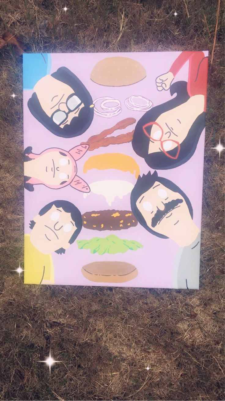 a poster is laying on the ground in the grass with some stars around it and people wearing glasses