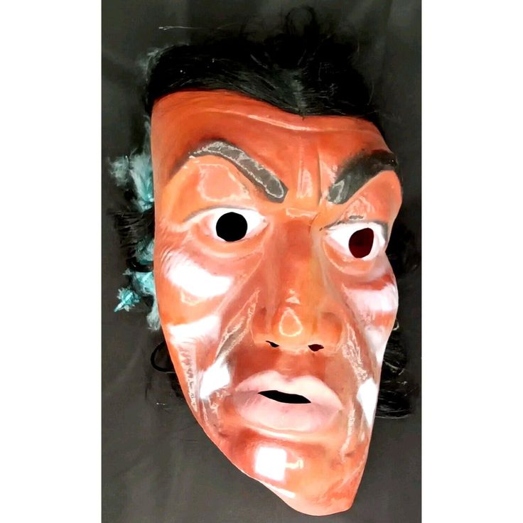 This Halloween mask by Topstone is a must-have for any trick or treat enthusiast. The multicolor plastic mask features an Indian chief design, perfect for any Halloween occasion. Made in Hong Kong in the 1960s, this vintage mask is a rare find and sure to impress any collector. Whether you're looking to add to your collection or just want a unique costume piece, this mask is perfect. Halloween Mask  Indian Chief Topstone  With Original Paper Tag  1960s  Trick Or Treat  Holiday Decor  The measurements are: 14" x 6" x 4" What a great find!  There is wear and tear due to improper storage through the years.   This will need a gentle cleaning.  Please review and zoom in on each image for condition detail.  All sides and aspects of the mask are shown.  Refer to the item description for measureme Vintage Mask, Plastic Mask, 2nd Chance, Trick Or, Unique Costumes, Halloween Mask, Indian Chief, Costume Mask, Halloween Items