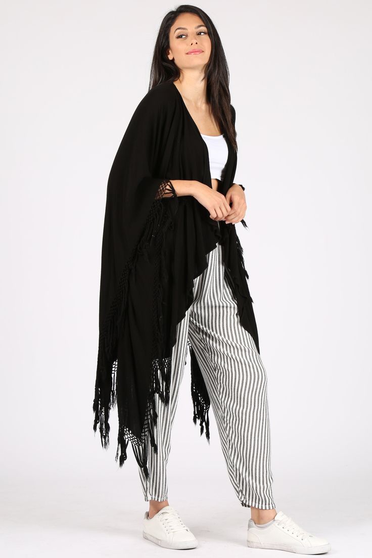 A light take on the poncho, this versatile piece can also act as a shawl and beach coverup. Please note this style is unisex. Fabric Content: 60% Cotton, 40% Rayon, made in Morocco. Sizing: O/S