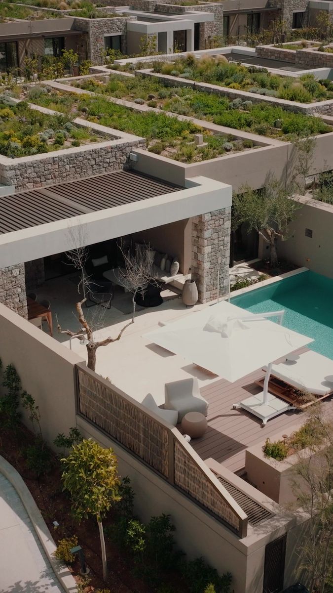 an aerial view of a house with a swimming pool