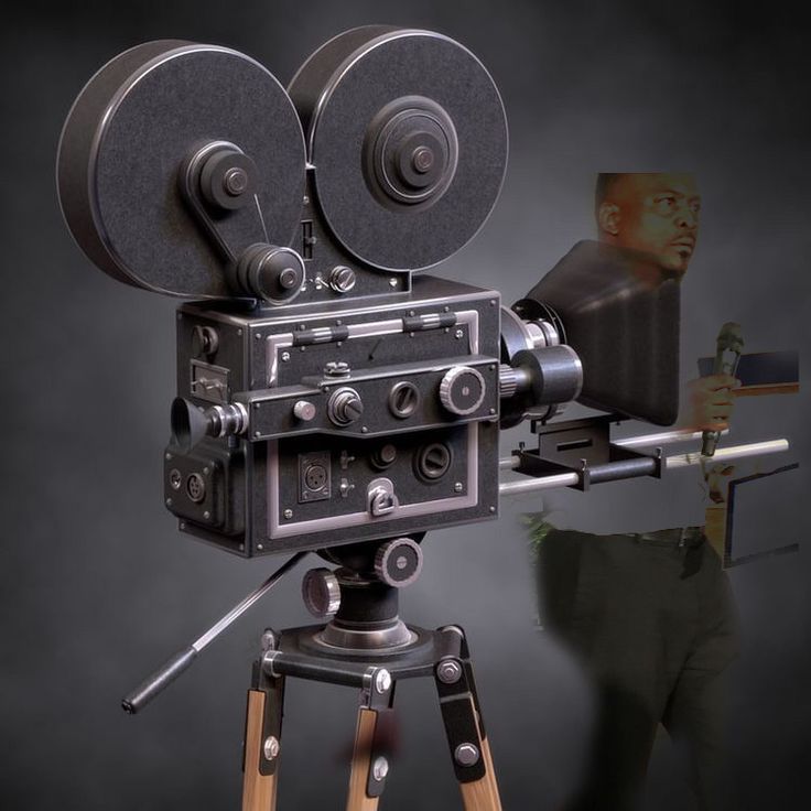 an old fashioned movie camera on a tripod