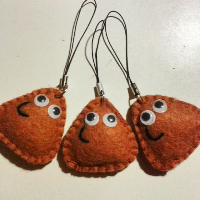 three pieces of felt with eyes on them