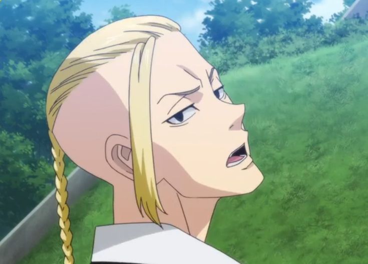 an anime character with blonde hair standing in front of green grass and trees, looking off into the distance