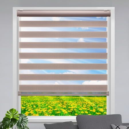 a living room with a window covered in blinds and yellow flowers on the windowsill