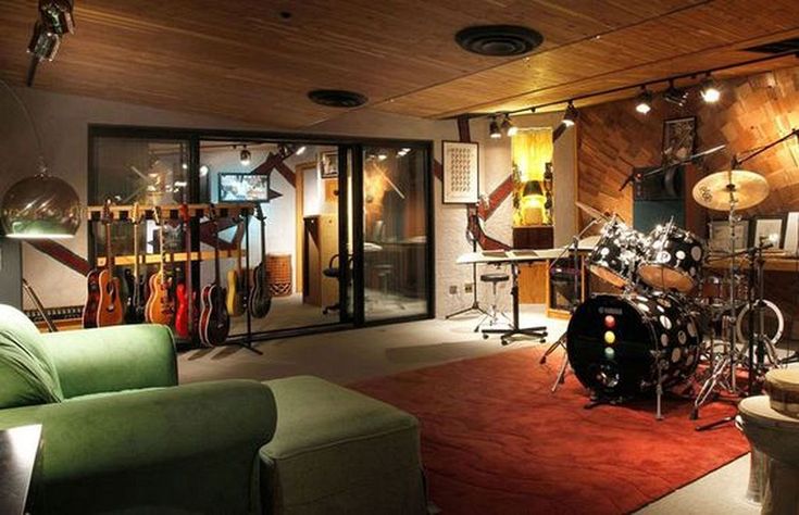 a living room filled with furniture and musical instruments