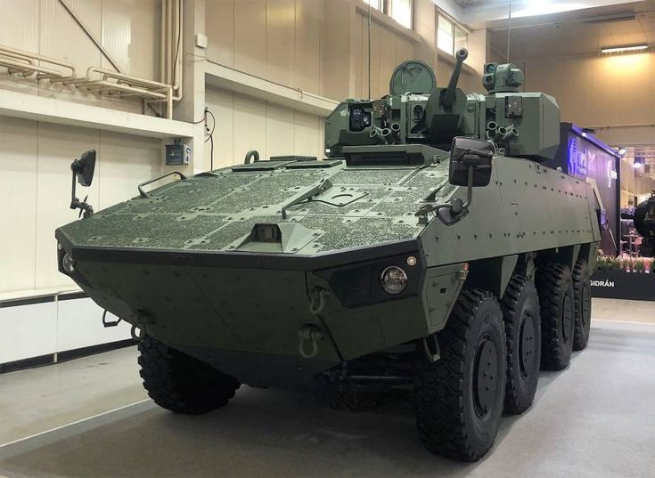 an army vehicle is parked in a building