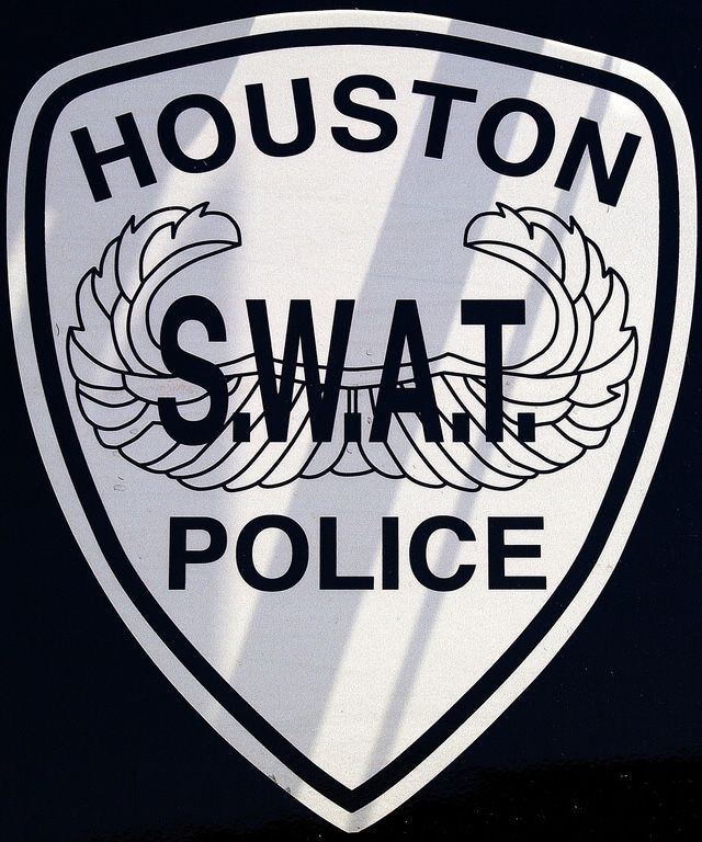 the houston swat police logo is shown in black and white