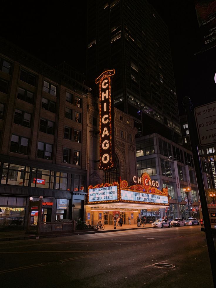 the chicago theatre is lit up at night