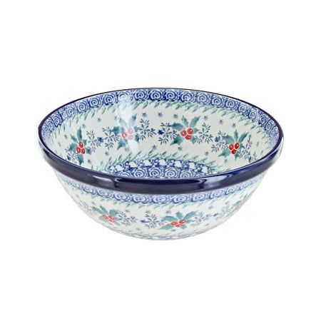 a blue and white bowl with flowers on it