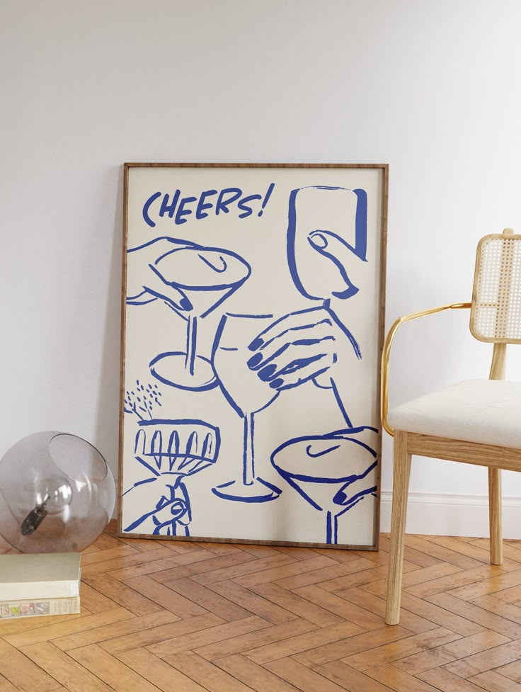 a chair sitting next to a painting on top of a hard wood floor in front of a white wall