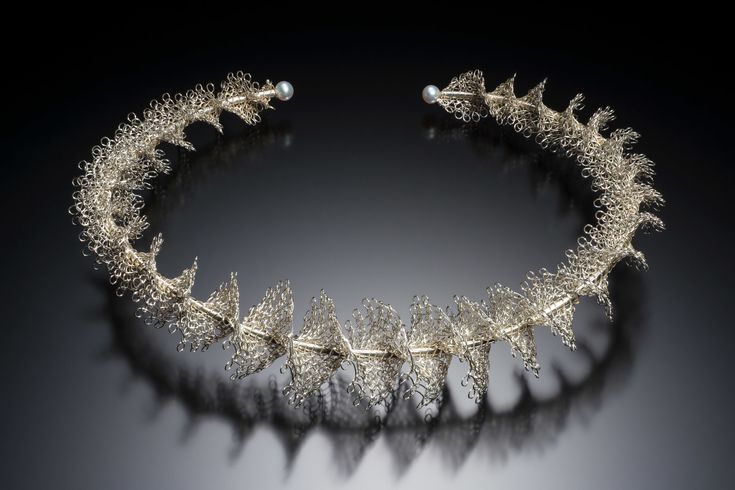 a tiara made out of silver leaves