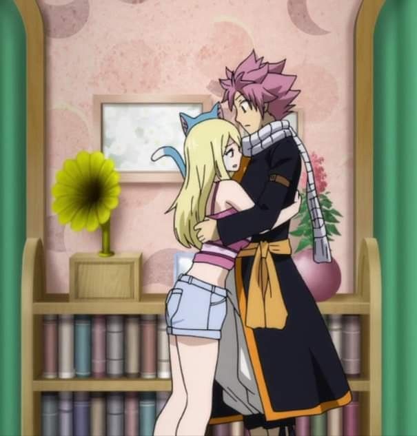 two anime characters hugging each other in front of a book shelf with books on it