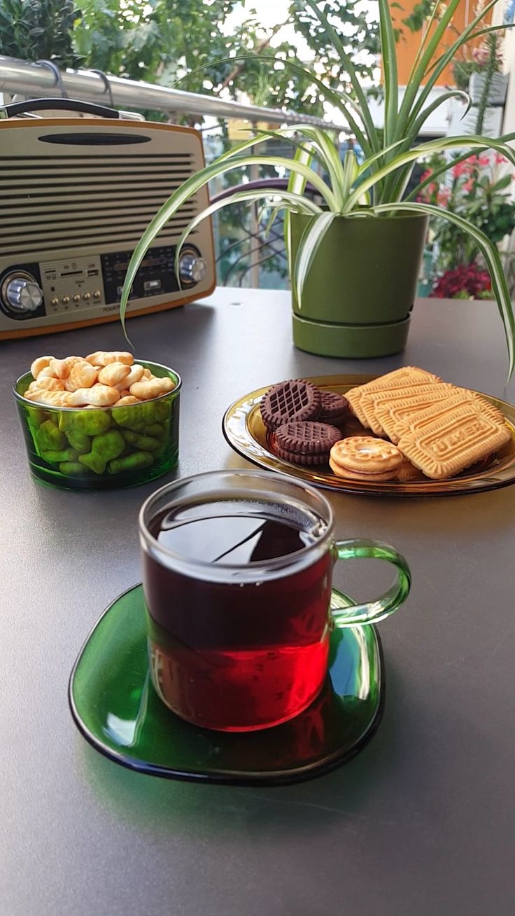 a cup of tea and some cookies on a table