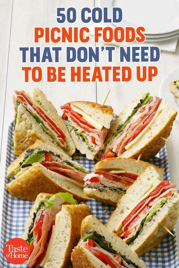 a bunch of sandwiches sitting on top of a blue and white checkered plate with the words 50 cold picnic foods that don't need to be heated up