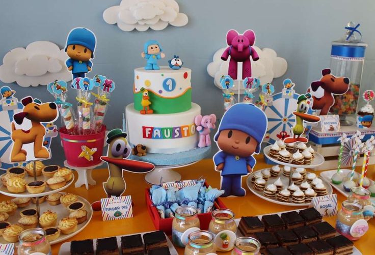 a table topped with lots of cakes and desserts