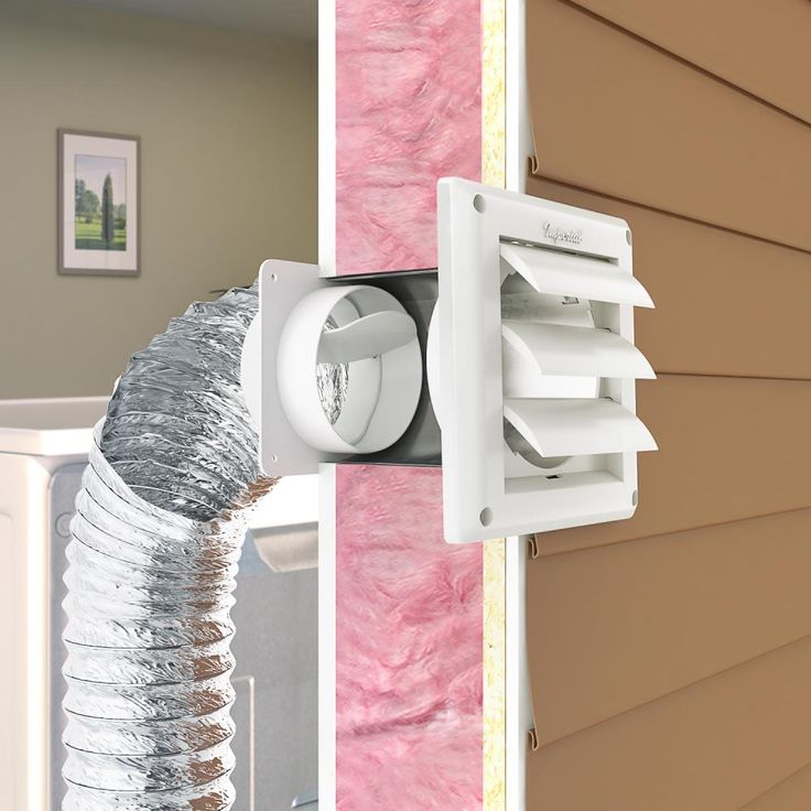 a duct outlet attached to the side of a house with pink and brown siding on it