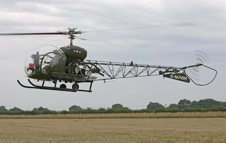 a helicopter that is flying in the air