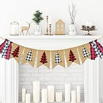 a fireplace decorated for christmas with stockings and candles