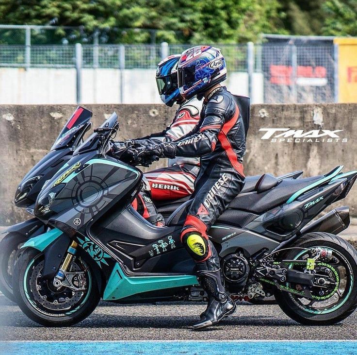 a man riding on the back of a motorcycle