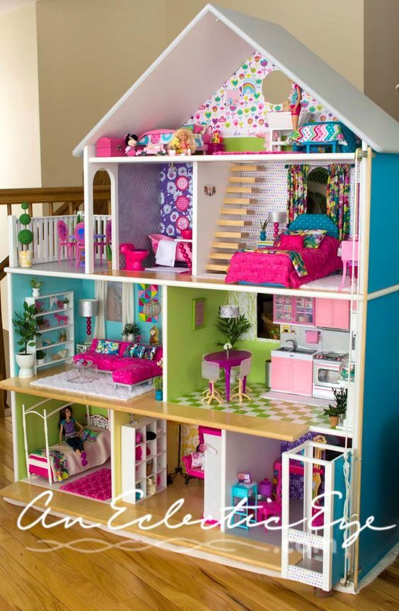 a doll house with lots of furniture and accessories